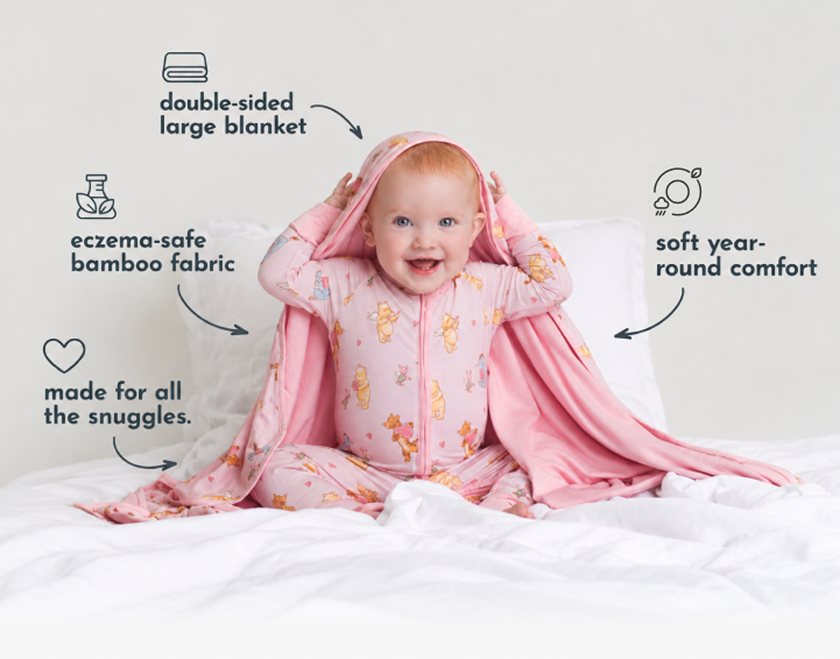Baby under a double-sided bamboo blanket - eczema-safe fabric with soft year-round comfort